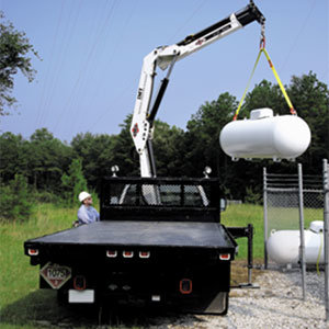 NCCER Articulating / knuckle boom crane moving tanks.