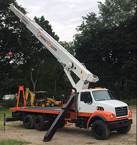 Telescoping boom crane with Cranes101 logo in orange - about us