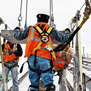 Construction industrial safety certification courses image: worker in safety harness and vest